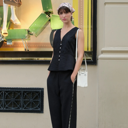 Vauratelier Miner black jacquard textured blazer vest with pearl buttons and matching wide-leg pants.